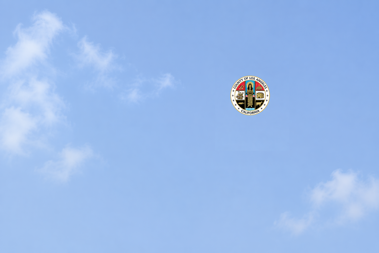 blue sky, clouds with la county logo